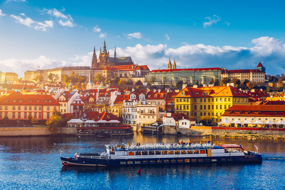 Prague,Castle,,Charles,Bridge,And,Boats,On,The,Vltava,River.